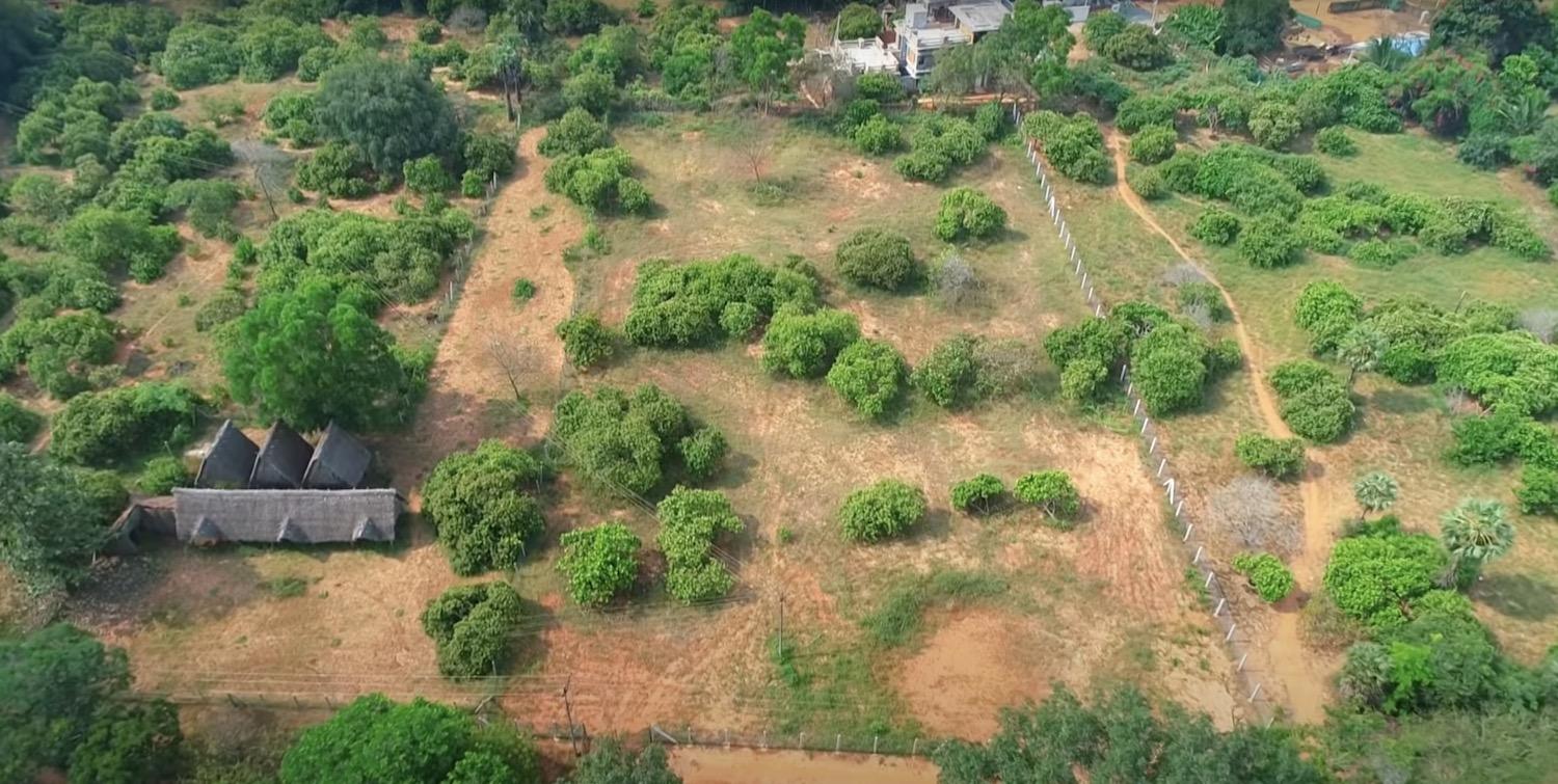 02 drone view front - Land with Main Road Frontage in Auroville