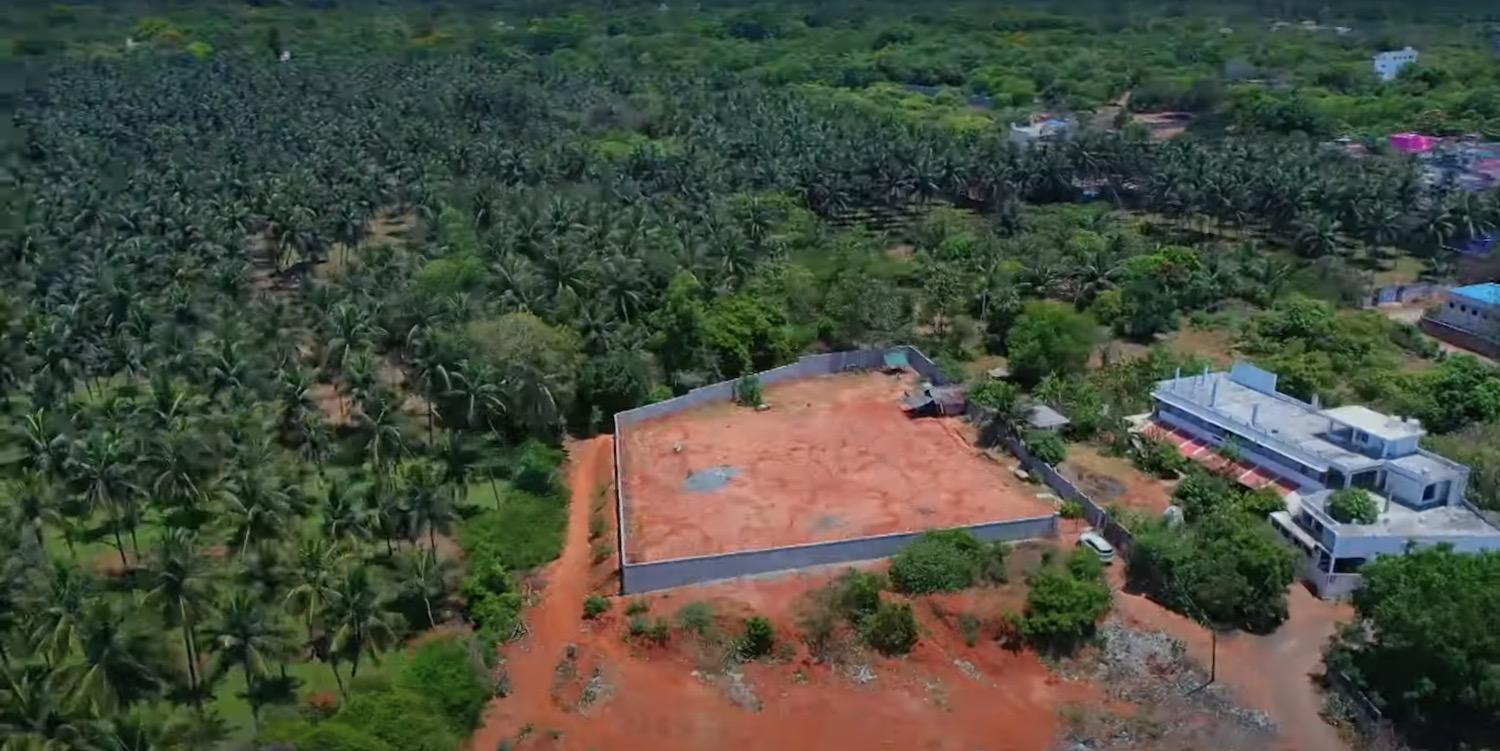 03 drone view side far - Red Soil Land near Auro Beach in Auroville