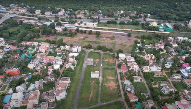 01 drone view train nh - CMDA Plots on NH45 in Vandalur - Perungalathur