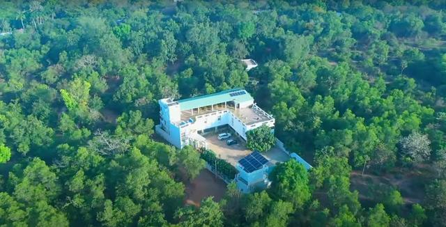 01 drone view far - Guest House with 24 Rooms in Auroville